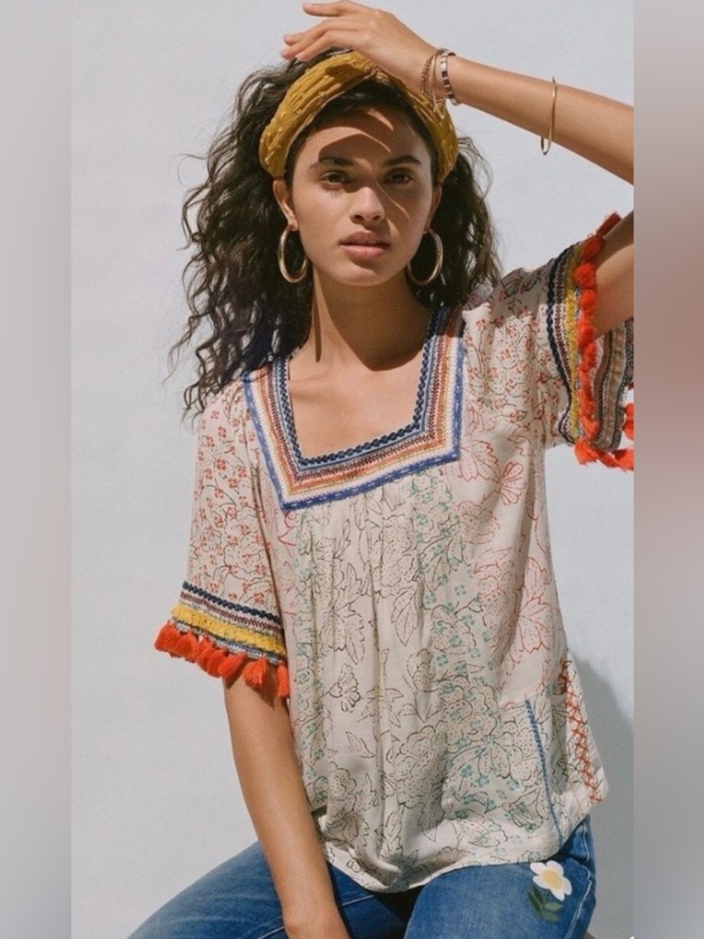 Maeve White Floral Peasant Top with Blue Trim and Orange Tassels